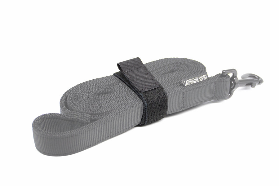 Dog leash with an elastic velcro wrap on a white background